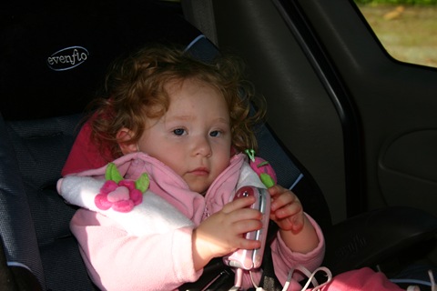 Sidney, sitting in the car with Grandma's phone
